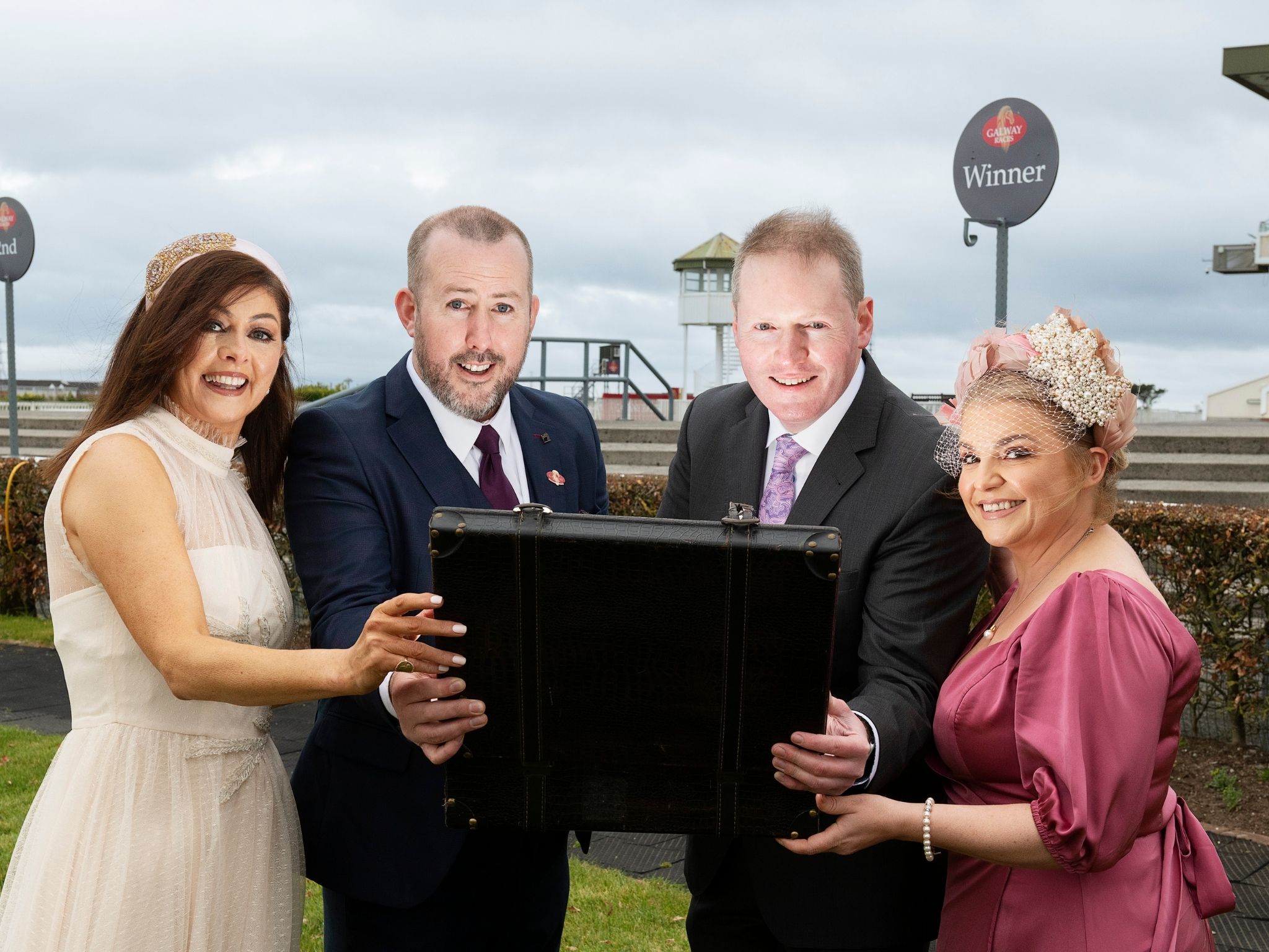 connacht hospitality group and galway races representatives with briefcase